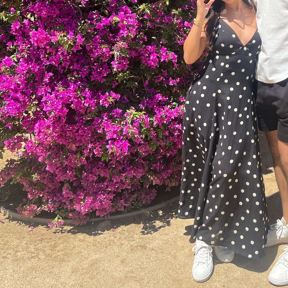 Black and white polka dot open back maxi dress with pockets